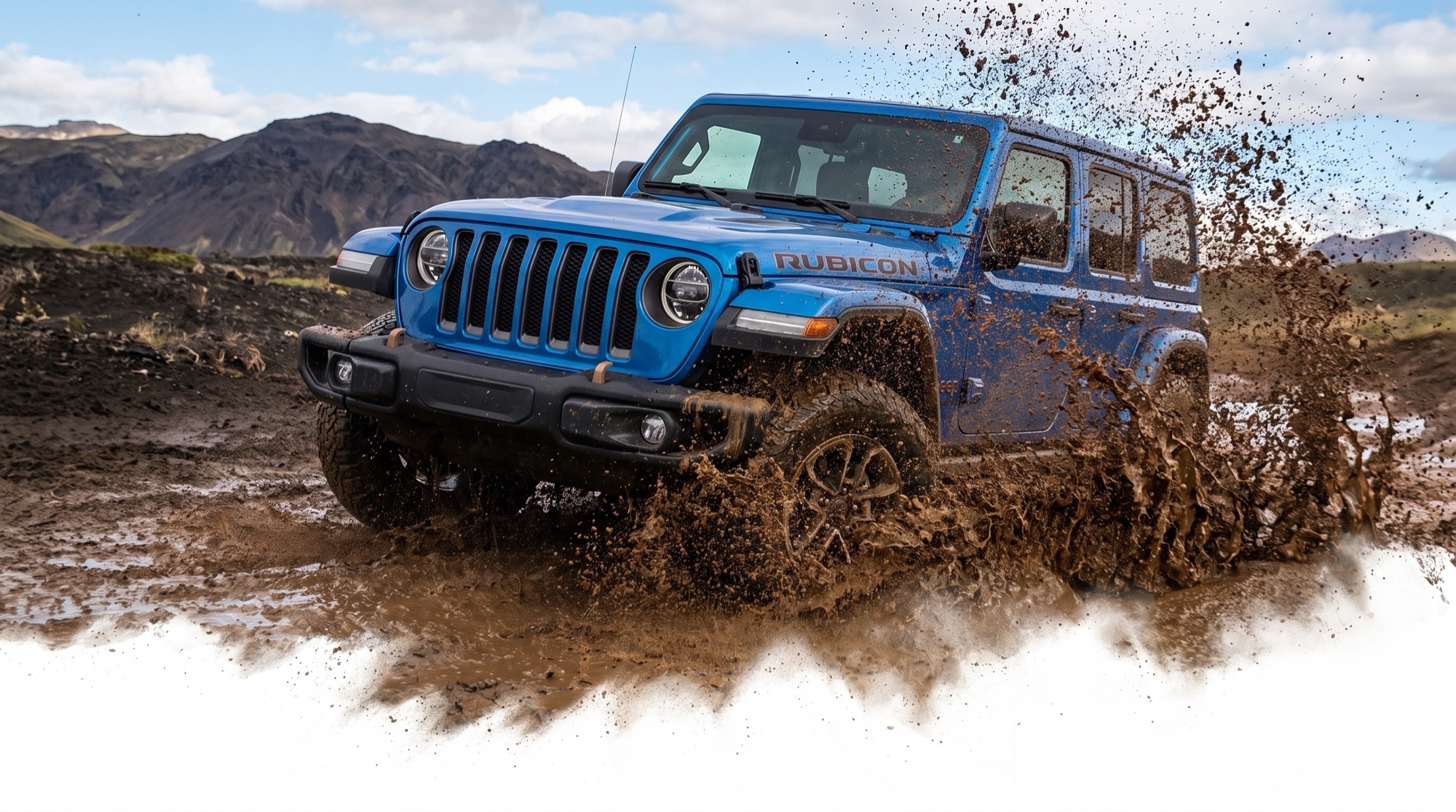 Blue 4-door Jeep Wrangler Rubicon powering through deep mud