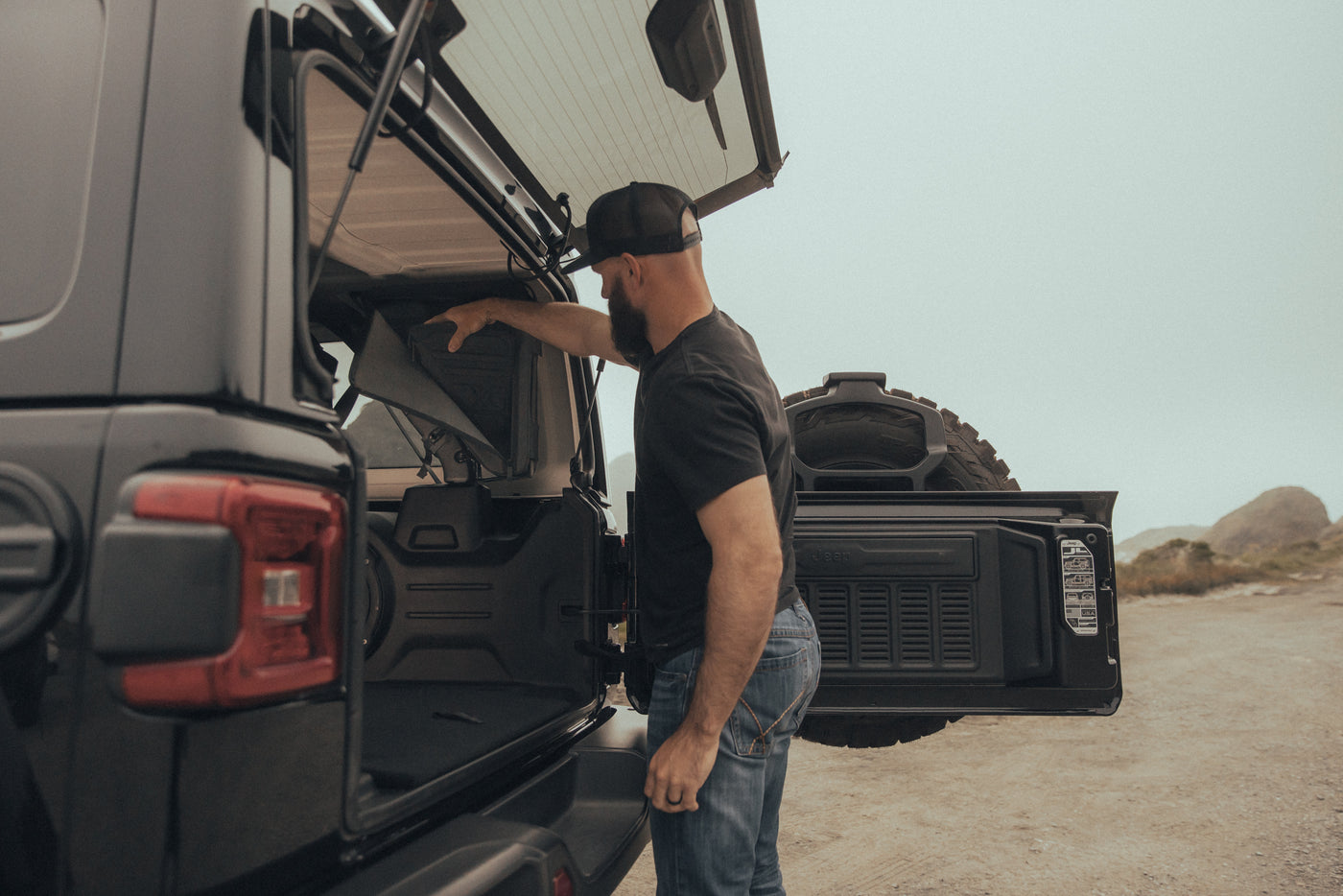 Gama in action — loading gear on the trail