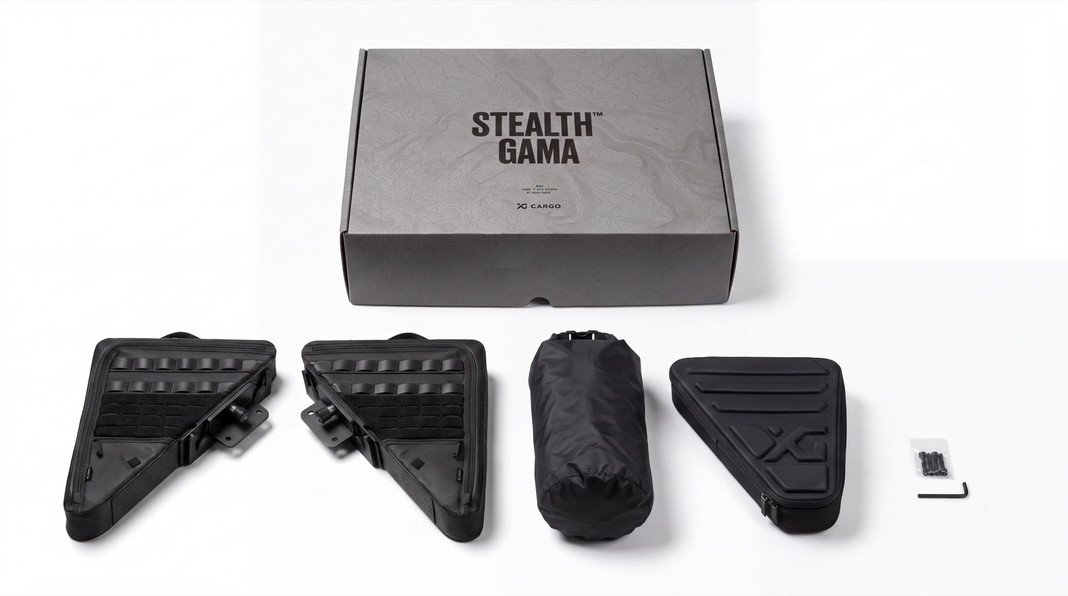 Everything in the Stealth Gama box — two GAMA panels, the roll-top dry bag, the Mini organizer, and mounting hardware